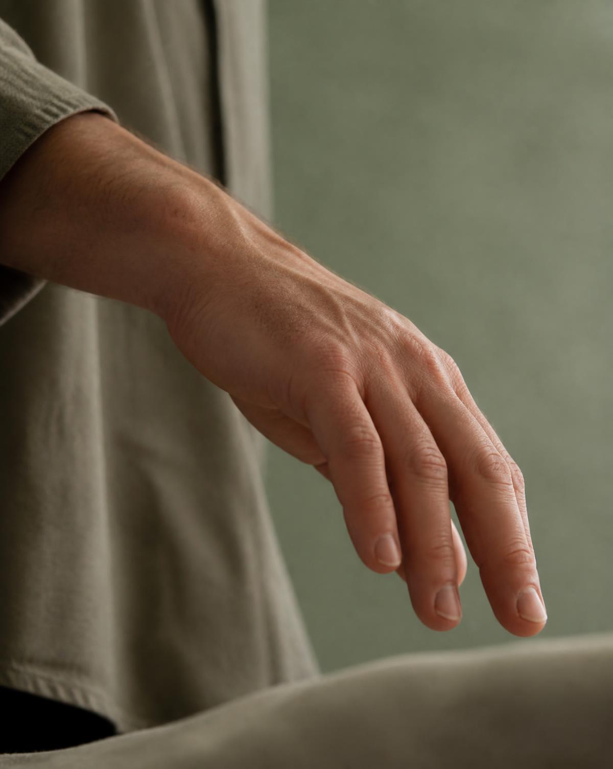 Close study of a hand moving slowly in natural light